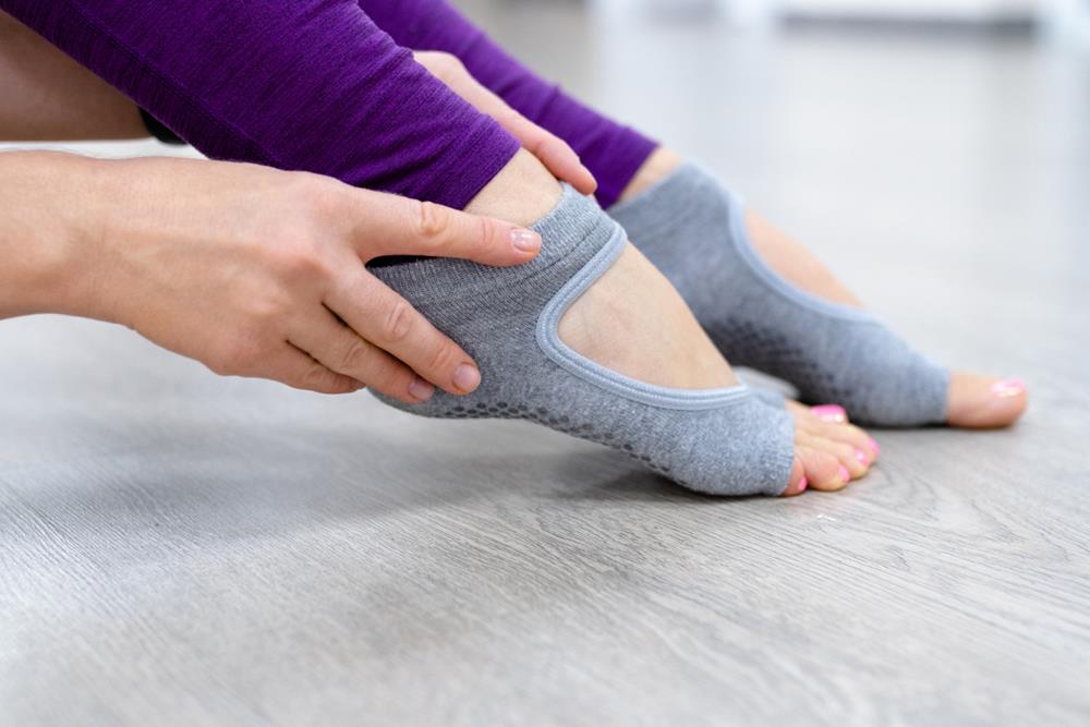 Wearing non-slip yoga socks