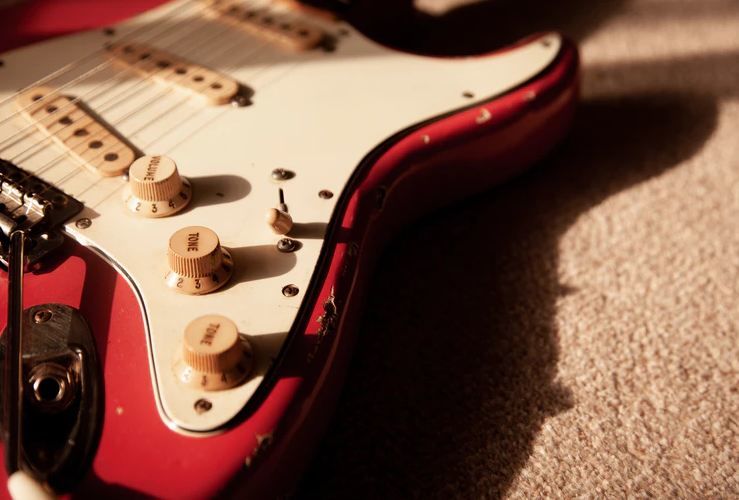 Stratocaster electric guitar with a tremolo bar