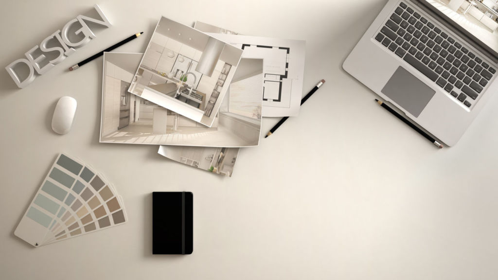 Architect designer concept, white work desk with computer, paper draft, kitchen project images and blueprint. Sample color material palette, creative background idea with copy space