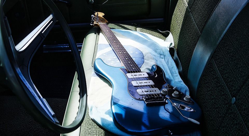 guitar on a car seat