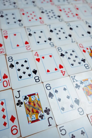 A close up of many playing cards on a table