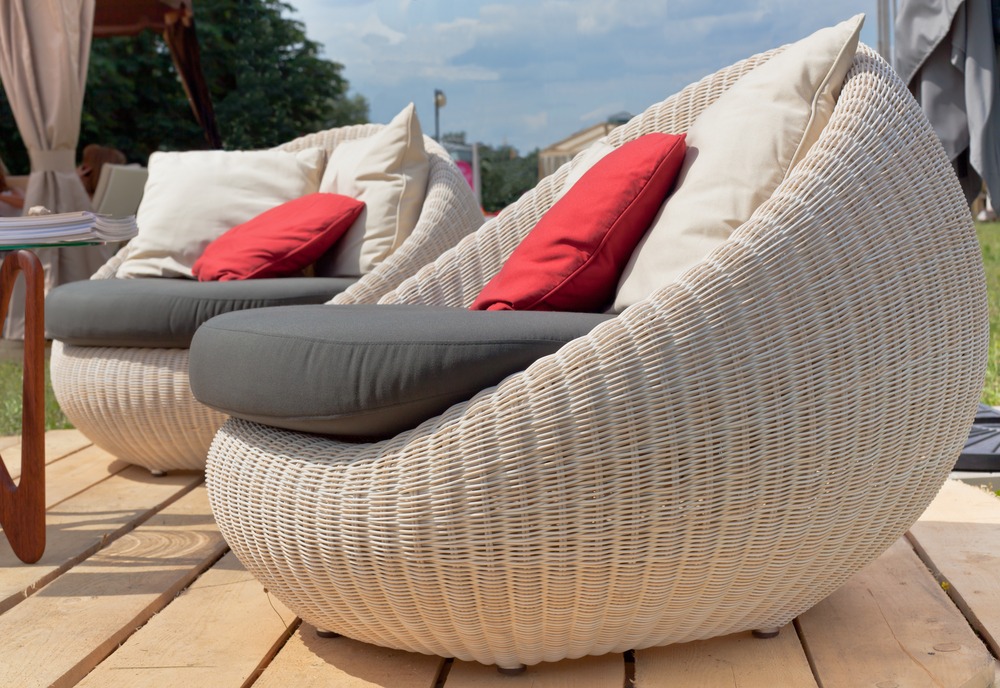 Soft armchairs with color pillows outdoors