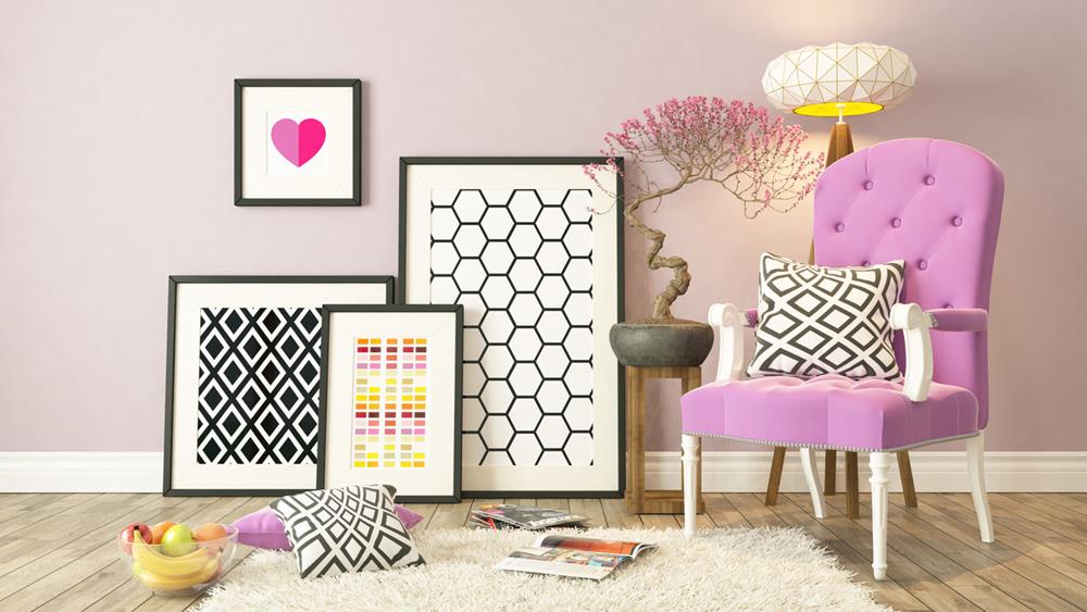 Picture frames with pink bergère and wooden parquet décor