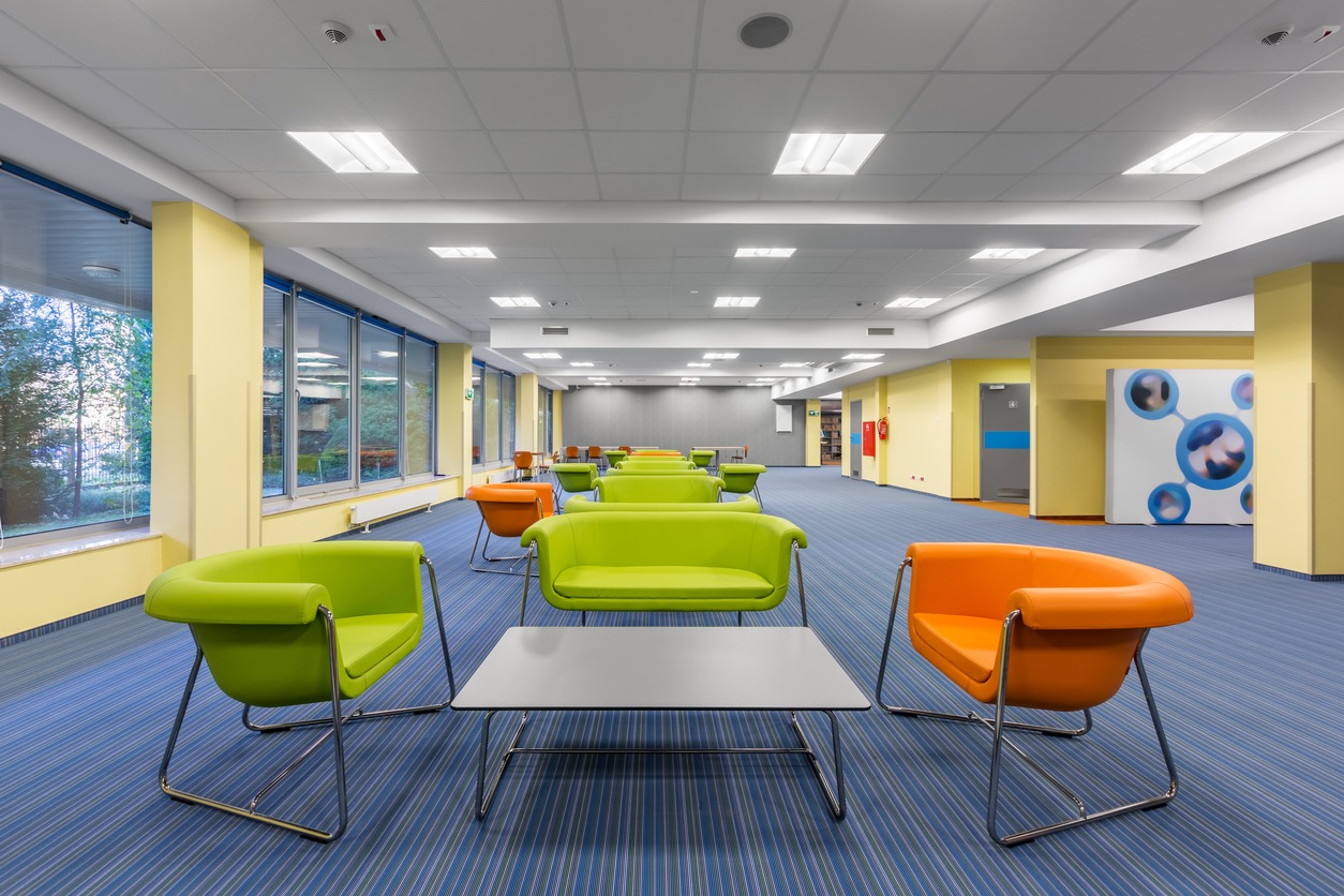 multi-color office space with green chairs