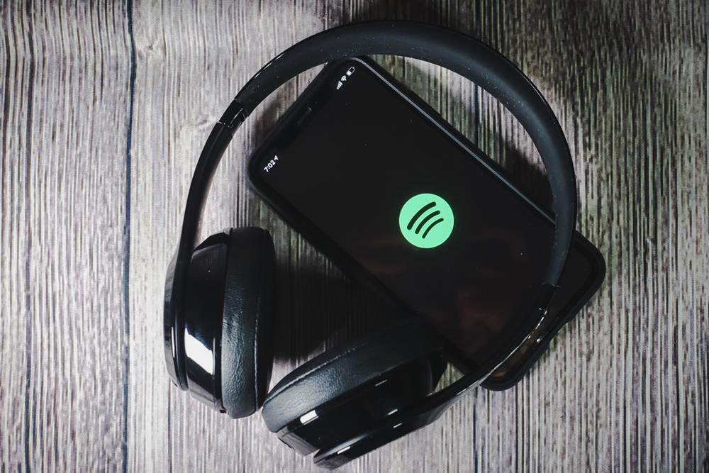 Spotify logo on the screen of a smartphone