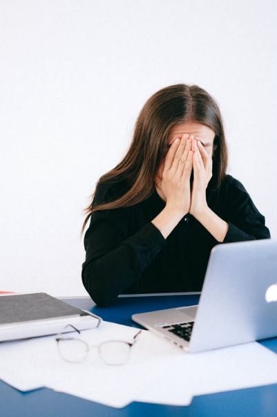 stressed-woman-covering-her-face-with-her-hands