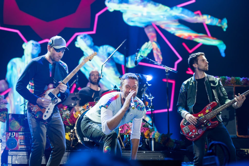 Coldplay, the most commercially successful post-Britpop band, on stage in 2017. Their first three albums - Parachutes (2000), A Rush of Blood to the Head (2002), and X&Y (2005) – are among the best-selling albums in UK chart history