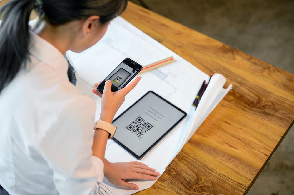 Person scanning a QR code