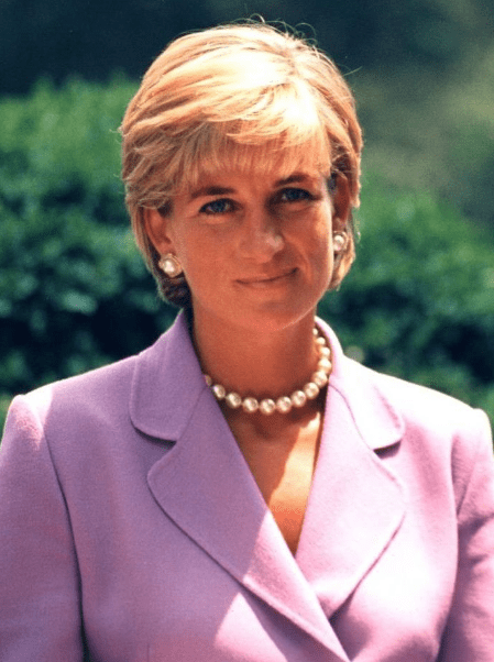 Princess Diana in a pink suit, wearing a pearl necklace