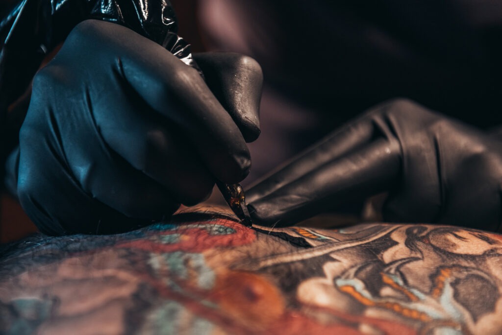 Shot of a tattoo artist hands image