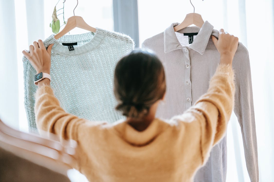 a woman choosing clothes
