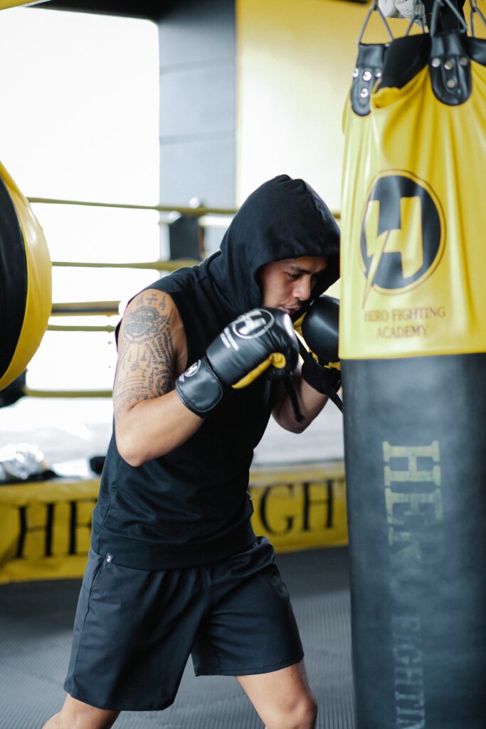 boxer working in gym with hooded gym tank top image
