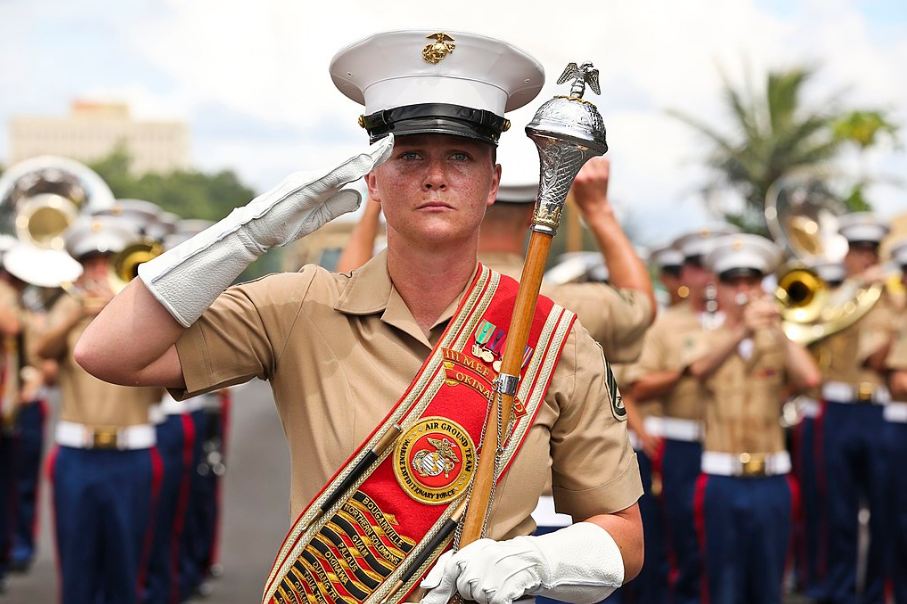 A drum major from the US III Marine doing a salute