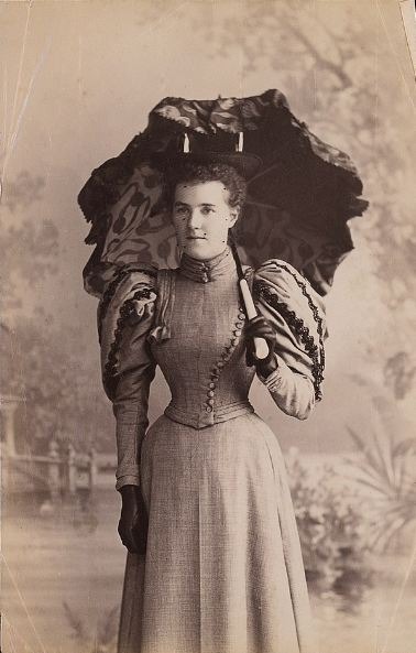 A woman holding a parasol