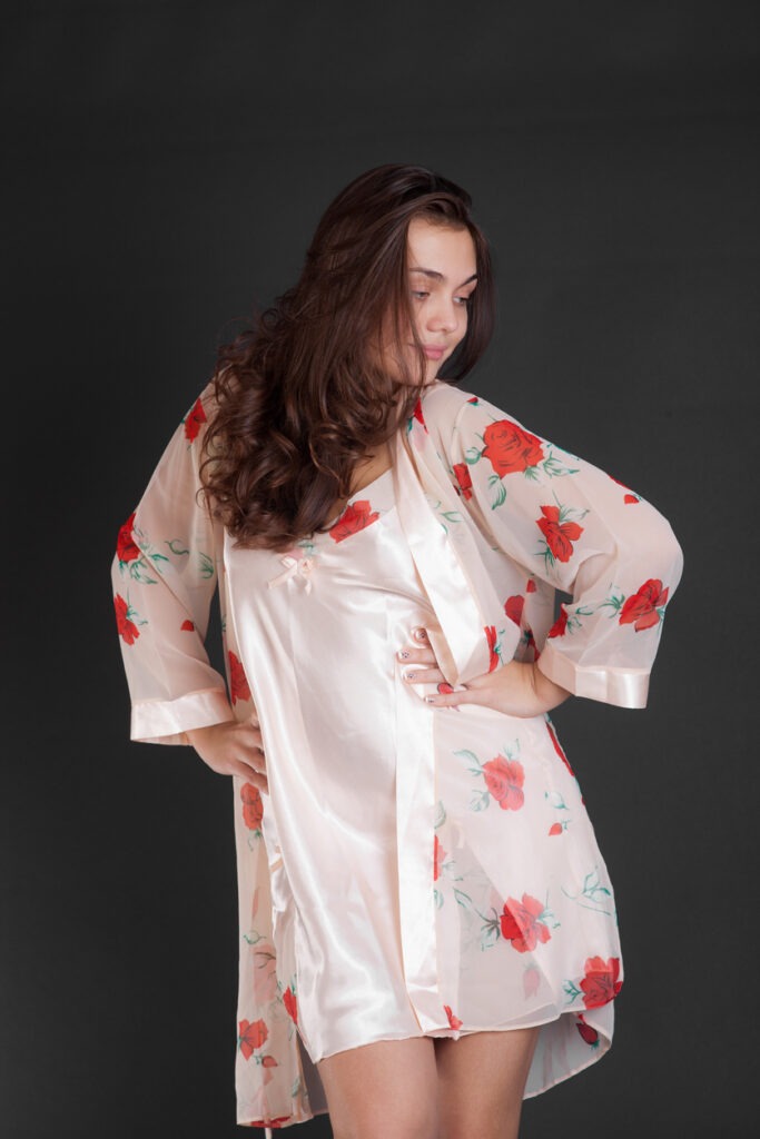 An image of A woman posing while wearing a chemise with a matching kimono