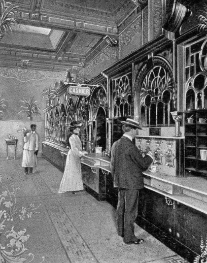 Image of an automat and people.