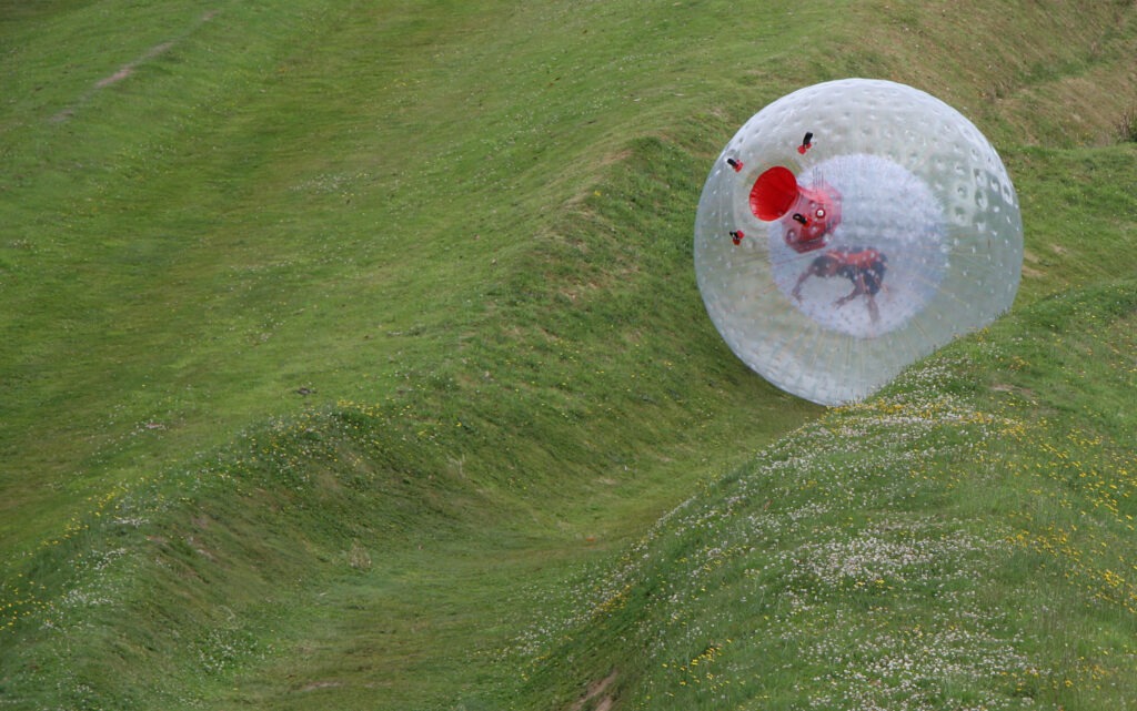 Zorb ball rolling down the hill