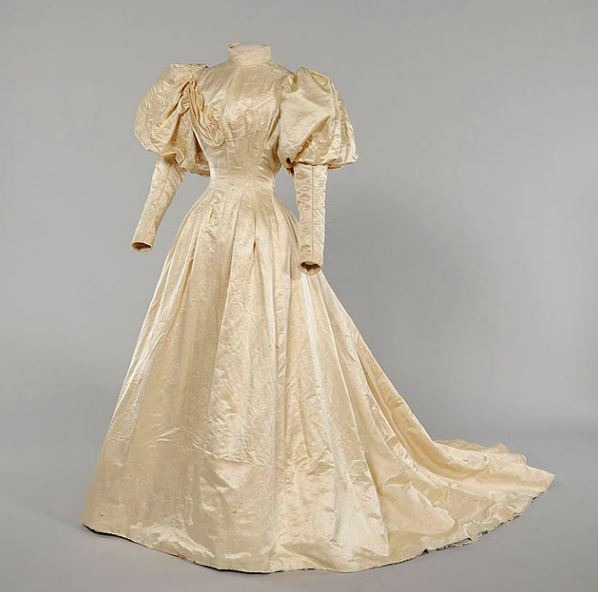 a dress with the gigot sleeves (puffy sleeves)