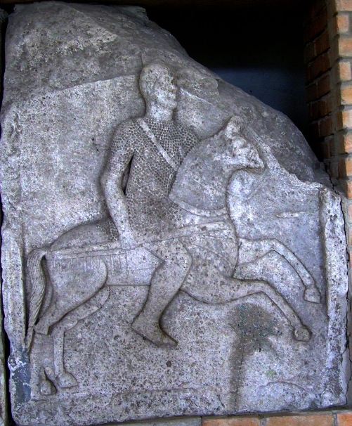 a stone carving of a Roman cavalry man