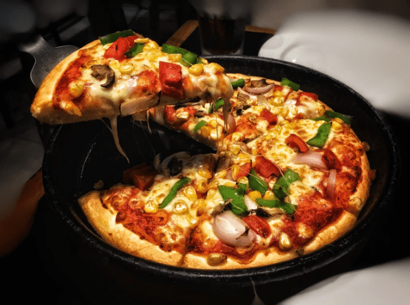 a supreme pizza on a pan