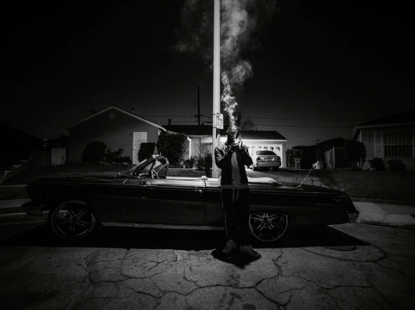 man smoking a cigarette in Compton
