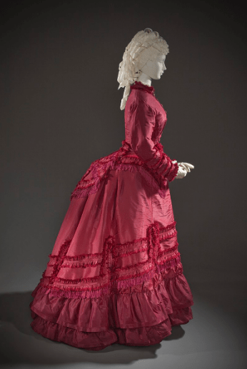 red dress with a bustle from 1870 