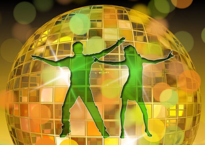 Green silhouette of a man and a woman on the disco ball
