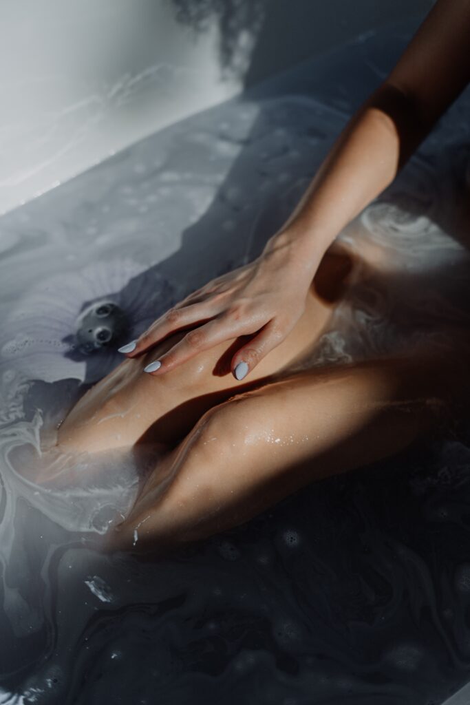 woman in water with water droplets image