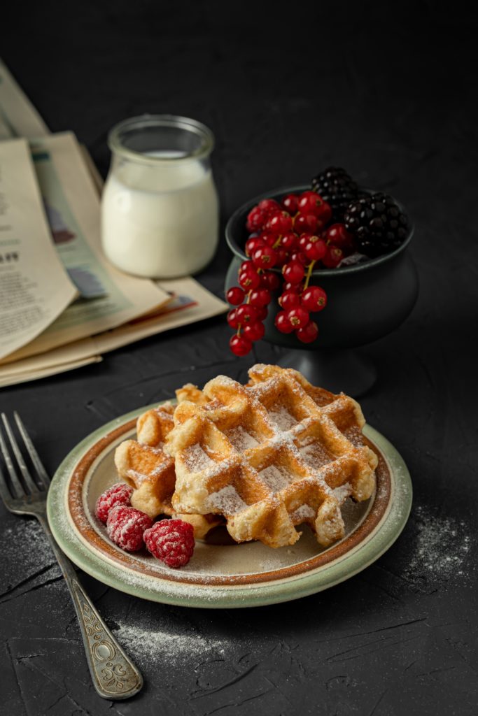 Delicious waffles with fresh raspberries for breakfast