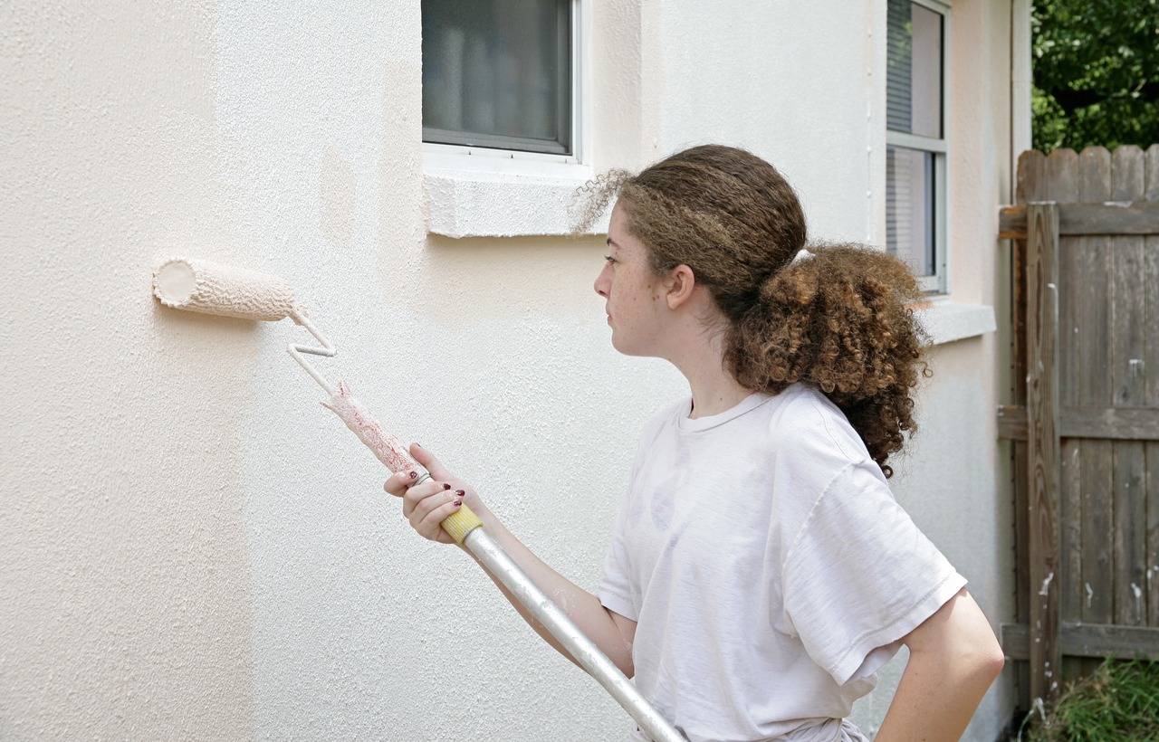Teen Girl With Paint Roller