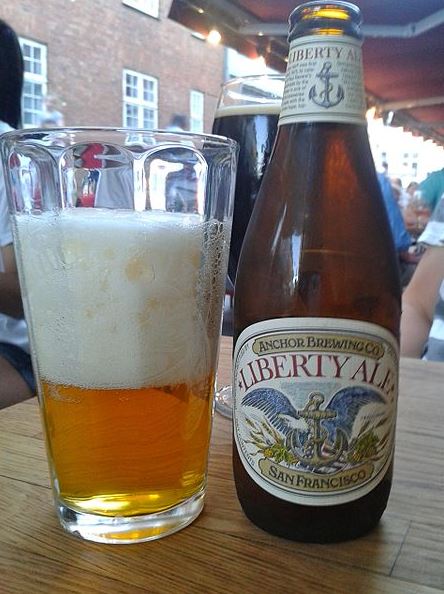 a bottle and glass of Anchor Liberty Ale