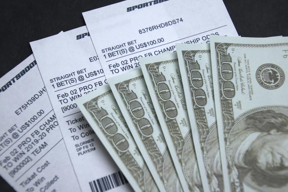 Sports betting receipts with money