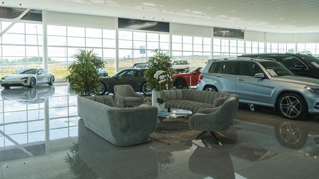 A picture of being at a dealership to find the perfect car.