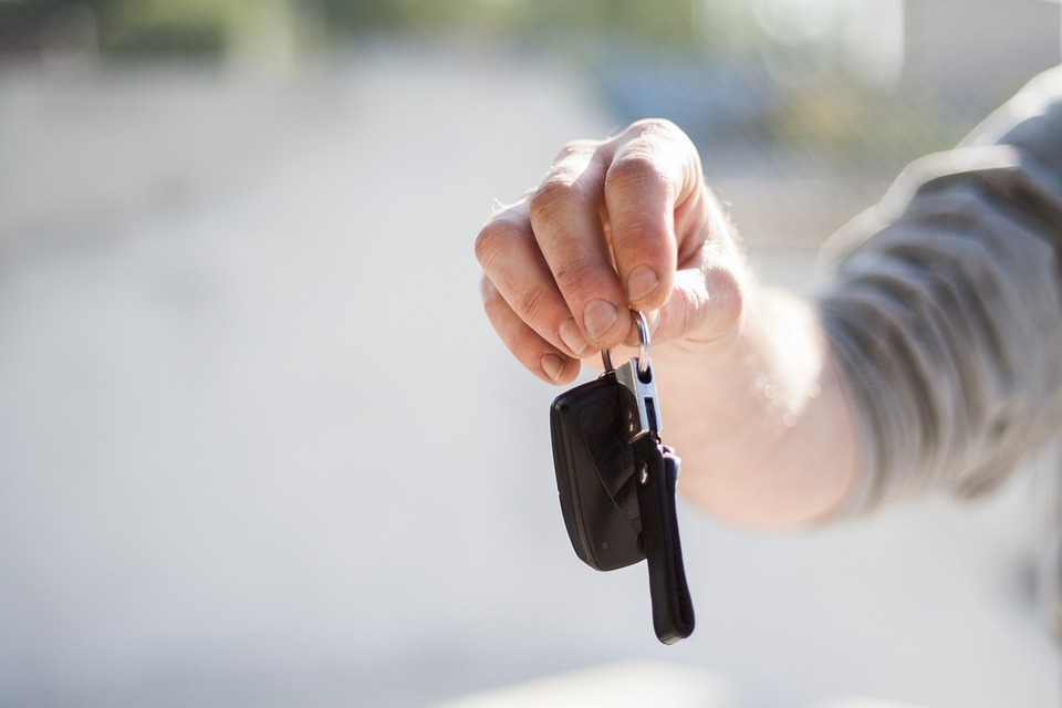 buying a car and holding a key image