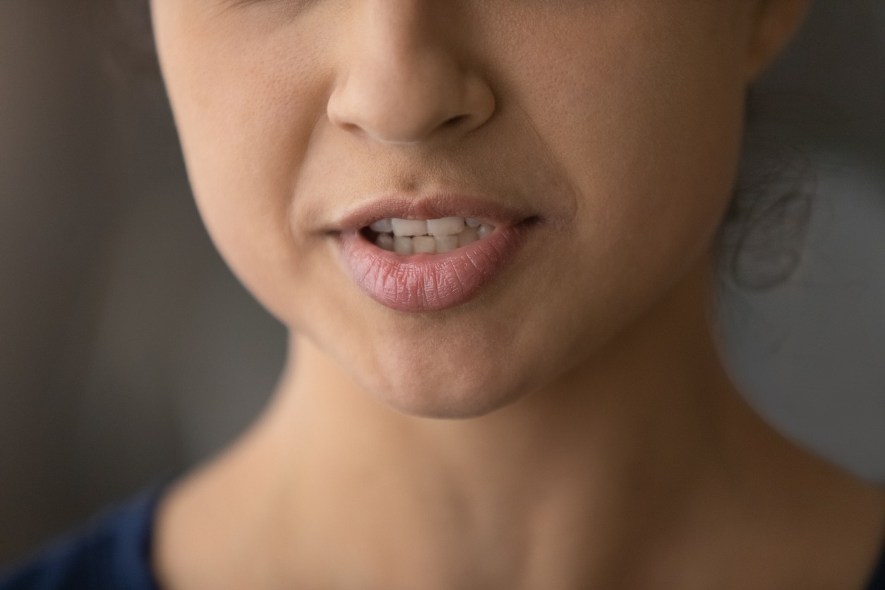 Close up of ethnic woman lips talk