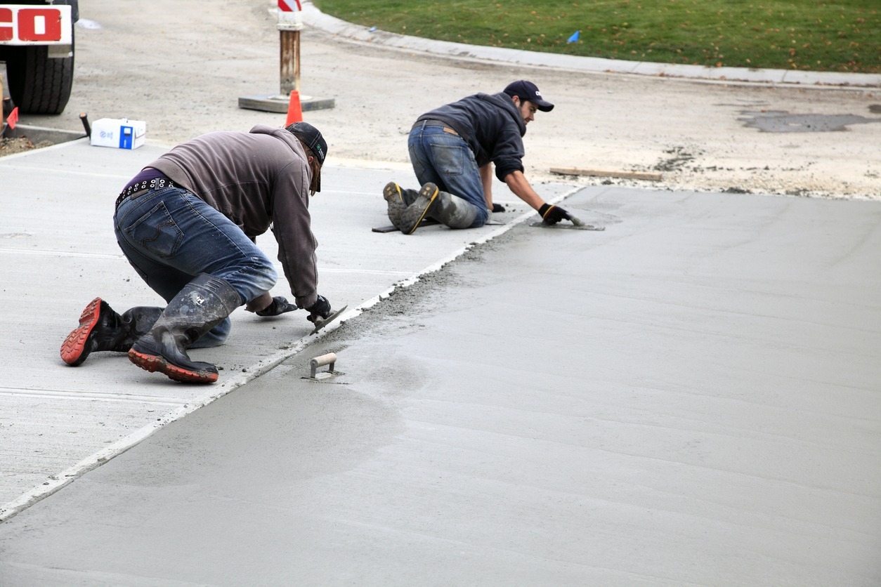 Hand Troweling New Residential Concrete Driveway