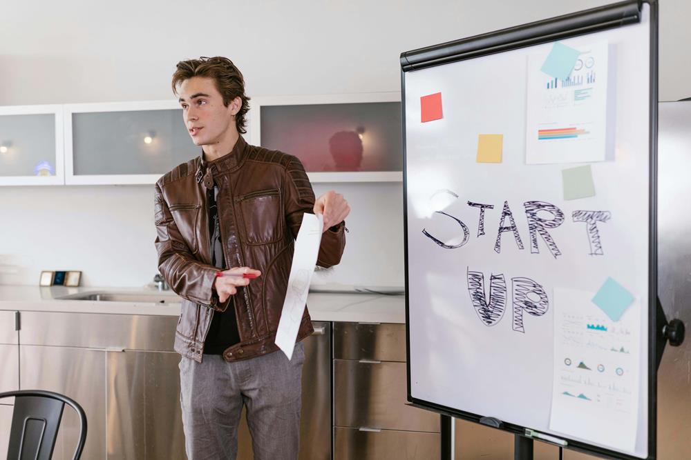 Young entrepreneur explaining a startup business
