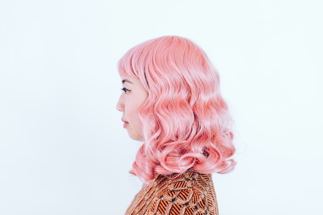 woman with curly pink hair lace wig