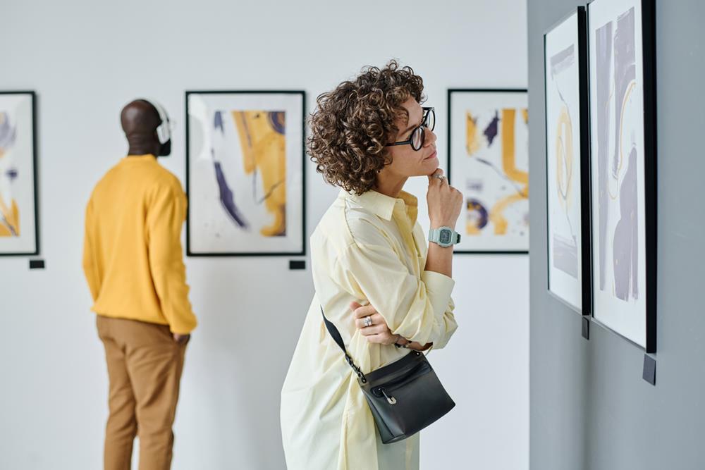 Woman looking at an artwork in a gallery