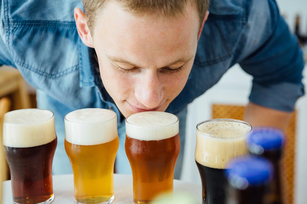 Man smelling different types of craft beer