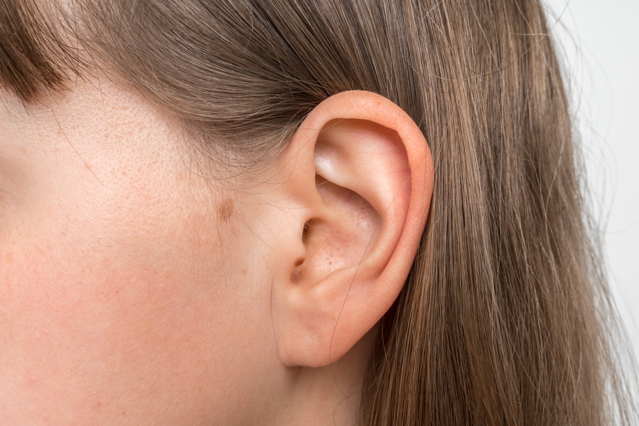 Close up of human head with female ear