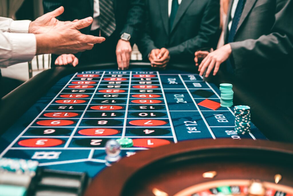 casino table with hands being dealt image