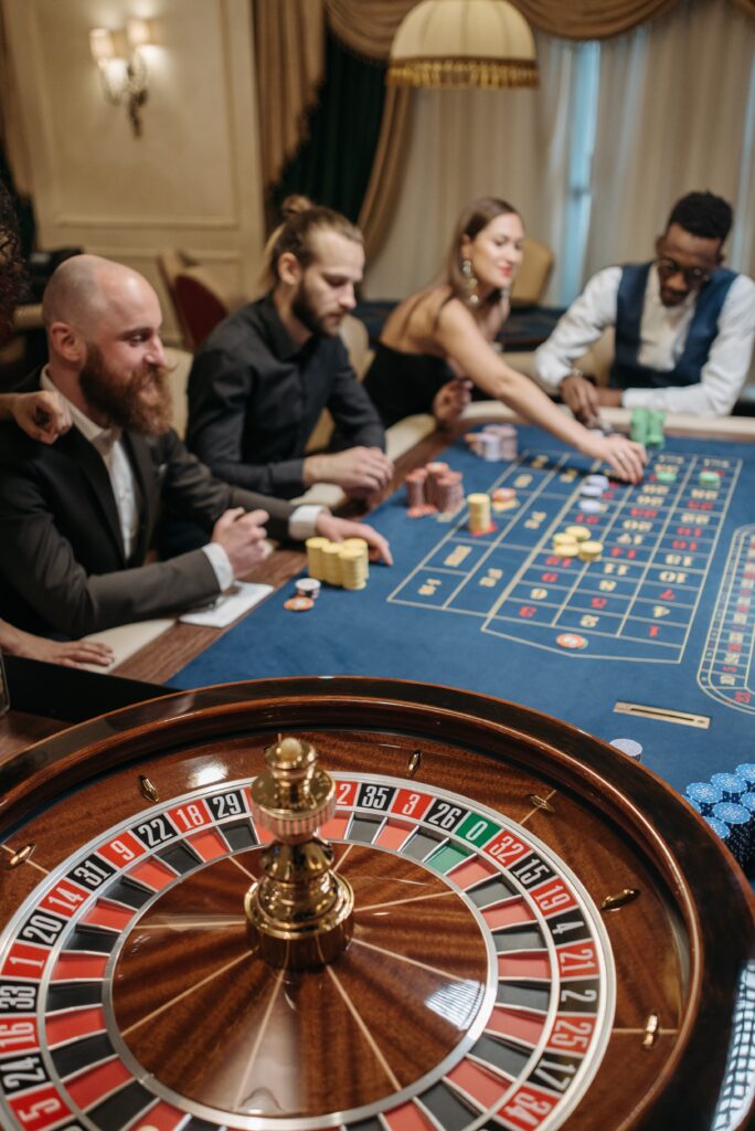 people around a table gambling image
