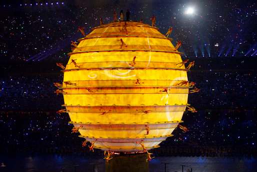 Performers dance on the surface of an illuminated sphere in the middle of National Stadium Friday, Aug. 8, 2008, during the Opening Ceremonies of the 2008 Summer Olympic Games in Beijing