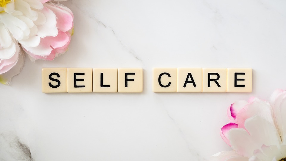 the term self-care spelled on letter tiles
