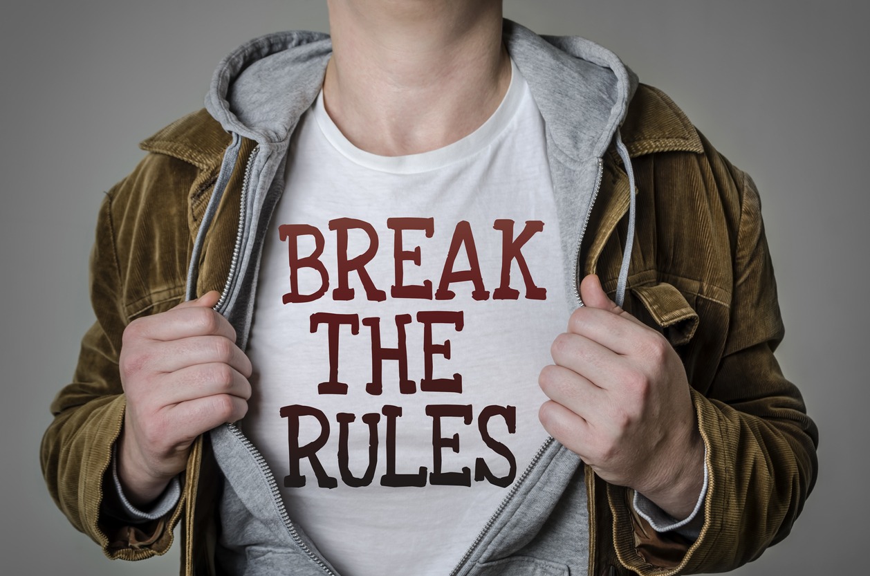 Man showing "Break the Rules" statement on t-shirt