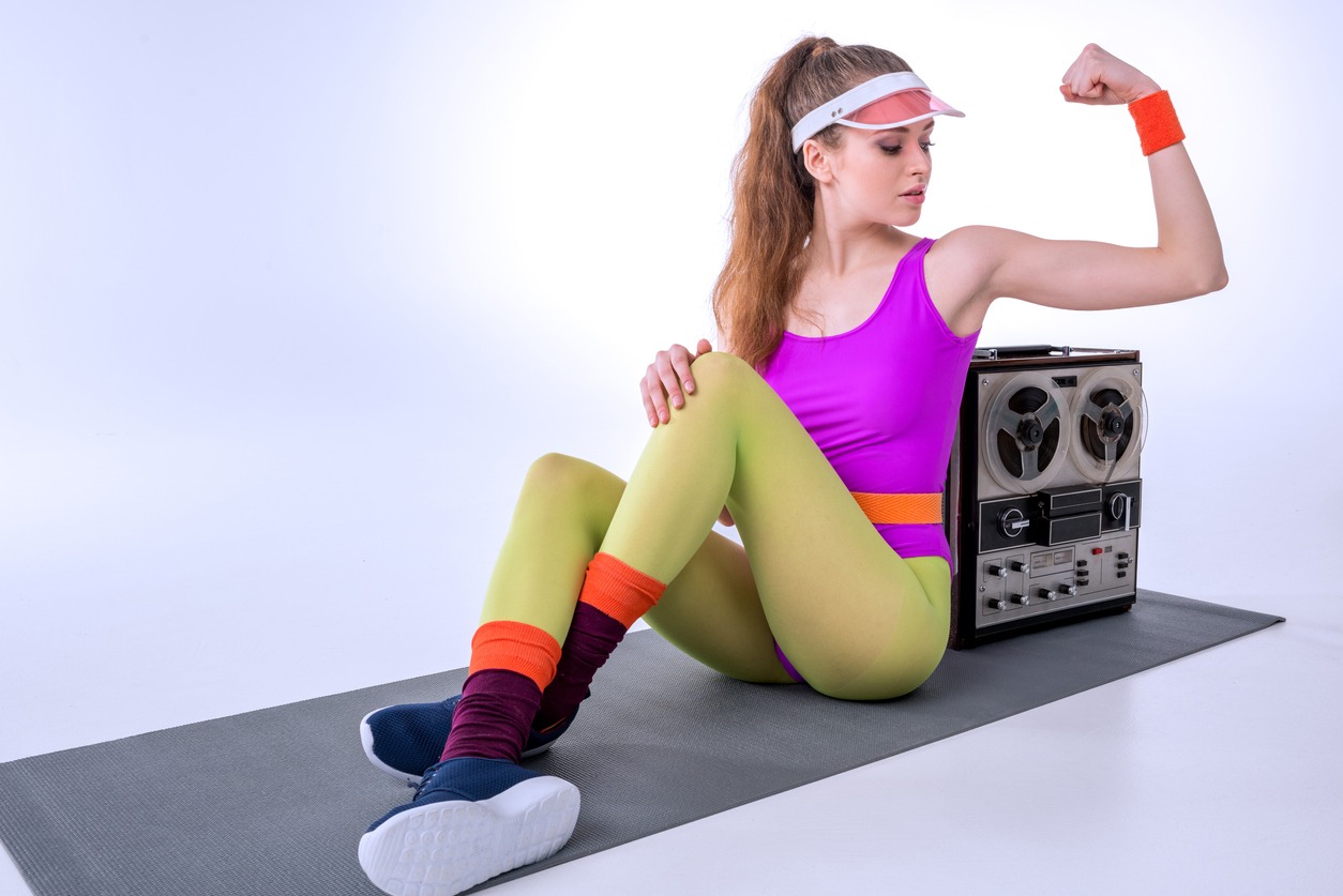 Woman wearing a 1980s aerobic outfit