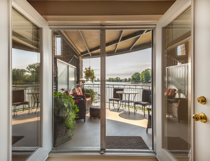 Lake and balcony view through patio doors