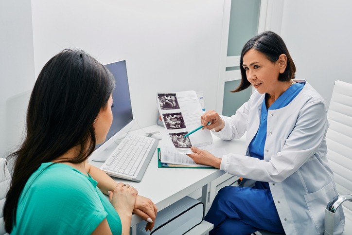 Adult woman getting consultation on her exam results and ovaries ultrasound from her gynecologist. Gynecology and treatment of gynecological diseases
