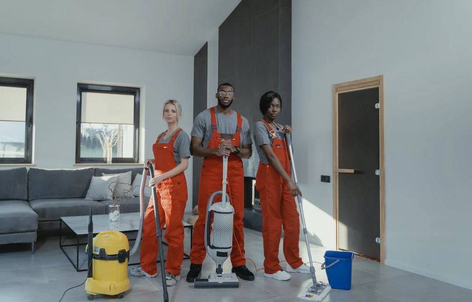 cleaners in orange uniform